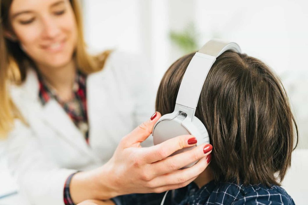 Audiologist Performing Hearing Test